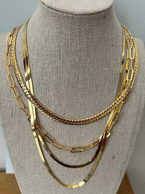 three gold necklaces